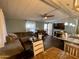 Inviting living room with comfortable seating, modern ceiling fan, and natural light at 9302 E Broadway Rd # 64, Mesa, AZ 85208