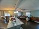 Open-concept living space combining kitchen, dining, and living areas with a ceiling fan at 9302 E Broadway Rd # 64, Mesa, AZ 85208