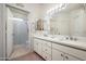 Bright bathroom with double vanity, quartz countertops, and a walk-in shower at 9550 E Thunderbird Rd # 259, Scottsdale, AZ 85260