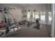 Bright gym featuring various fitness machines and access to an outdoor seating area at 9550 E Thunderbird Rd # 259, Scottsdale, AZ 85260