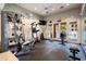 Modern gym with weights, cable machines, and mirrors for a complete workout experience, and pool view at 9550 E Thunderbird Rd # 259, Scottsdale, AZ 85260