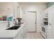 Bright kitchen with white cabinetry, modern appliances, and ample counter space at 9550 E Thunderbird Rd # 259, Scottsdale, AZ 85260