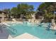 Upscale Community pool and spa surrounded by lush greenery at 9550 E Thunderbird Rd # 259, Scottsdale, AZ 85260