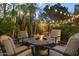 Inviting backyard with an outdoor fire pit and comfortable seating area for cozy evenings at 12593 E Desert Cove Ave, Scottsdale, AZ 85259