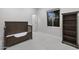This bedroom features a dark wood crib, a large window, and neutral carpeting at 12593 E Desert Cove Ave, Scottsdale, AZ 85259