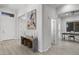 Foyer featuring light tile flooring, natural wood bench with baskets and artwork on the wall at 12593 E Desert Cove Ave, Scottsdale, AZ 85259