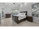 The spacious main bedroom is filled with natural light and features wood look floors at 12593 E Desert Cove Ave, Scottsdale, AZ 85259