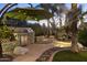 Outdoor kitchen equipped with a built-in grill and stone accents for stylish outdoor dining at 12593 E Desert Cove Ave, Scottsdale, AZ 85259