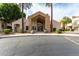 Inviting clubhouse entrance with palm trees and manicured landscaping for community gatherings at 1295 N Ash St # 125, Gilbert, AZ 85233