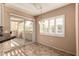 Bright dining area with a sliding glass door to the balcony and views at 1295 N Ash St # 125, Gilbert, AZ 85233