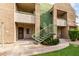 Balconies and exterior stairs on building with lush green landscaping at 1295 N Ash St # 125, Gilbert, AZ 85233