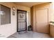 Cozy front door with welcome mat and security screen offers a warm entry at 1295 N Ash St # 125, Gilbert, AZ 85233