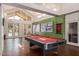 Bright game room with pool table, high ceilings, access to pool area, and modern design elements at 1295 N Ash St # 125, Gilbert, AZ 85233