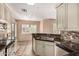 Updated kitchen with granite countertops, mosaic backsplash, and stainless steel appliances at 1295 N Ash St # 125, Gilbert, AZ 85233