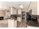 Well-equipped kitchen with granite counters, tiled backsplash, and easy access to the living areas at 1295 N Ash St # 125, Gilbert, AZ 85233