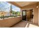 Relax on this welcoming patio featuring sliding door access and community views at 1295 N Ash St # 125, Gilbert, AZ 85233