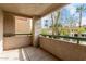 Enjoy outdoor living on this private patio with textured walls and garden views at 1295 N Ash St # 125, Gilbert, AZ 85233