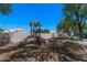 Community playground with slides and climbing structures set in a shaded, mulched area at 1295 N Ash St # 125, Gilbert, AZ 85233