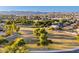 Community aerial view featuring green spaces, mature trees, and mountain vistas enhancing the neighborhood's charm at 1409 W Maria Ln, Tempe, AZ 85284