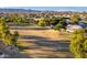 Aerial view of the community park with mature trees, sports fields, and residential surroundings at 1409 W Maria Ln, Tempe, AZ 85284