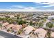 Aerial view of home in a residential community, showcasing tile roofs, landscaping and nearby businesses at 1409 W Maria Ln, Tempe, AZ 85284
