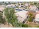 Aerial view of the backyard area, and the lush trees that shade the property in the community at 1409 W Maria Ln, Tempe, AZ 85284