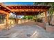 Inviting backyard patio area with a wood pergola perfect for entertaining at 1409 W Maria Ln, Tempe, AZ 85284