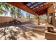 Expansive covered patio with pergola and relaxing stone waterfall feature at 1409 W Maria Ln, Tempe, AZ 85284