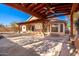 Large backyard covered patio featuring pergola, integrated lighting, and water feature at 1409 W Maria Ln, Tempe, AZ 85284