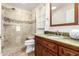 A stylish bathroom with glass shower and vanity at 1409 W Maria Ln, Tempe, AZ 85284