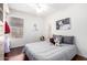 Bedroom with bed, hardwood floors and bright lighting at 1409 W Maria Ln, Tempe, AZ 85284