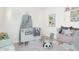 Stylized bedroom with soft carpet, a baby bed and accessories at 1409 W Maria Ln, Tempe, AZ 85284