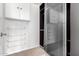 Walk-in closet featuring custom shelving, hanging racks, and ample storage space at 1409 W Maria Ln, Tempe, AZ 85284