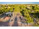 Aerial view of community park with playground, covered picnic areas, mature trees, and walking paths at 1409 W Maria Ln, Tempe, AZ 85284