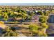 Aerial view of community park with playground, covered picnic areas, mature trees and sidewalks at 1409 W Maria Ln, Tempe, AZ 85284