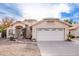 Charming single-story home with a well-manicured front yard and a spacious two-car garage at 1409 W Maria Ln, Tempe, AZ 85284