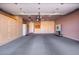 Spacious garage with ample storage cabinets and well-lit interiors at 1409 W Maria Ln, Tempe, AZ 85284