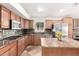 Well-equipped kitchen featuring granite counters, a breakfast bar, and stainless steel appliances at 1409 W Maria Ln, Tempe, AZ 85284