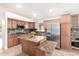 Spacious kitchen with granite countertops, stainless steel appliances, and center island at 1409 W Maria Ln, Tempe, AZ 85284