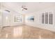 Bright and airy living room featuring tile flooring, white walls, and large windows for ample natural light at 1409 W Maria Ln, Tempe, AZ 85284