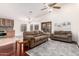 Open-concept living space with kitchen, vaulted ceiling, and comfortable sofas at 1409 W Maria Ln, Tempe, AZ 85284