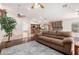 Inviting living room flows into a modern kitchen with stainless steel appliances and a large island at 1409 W Maria Ln, Tempe, AZ 85284