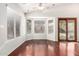 Sun-filled living room features a sliding glass door and a large bay window at 1409 W Maria Ln, Tempe, AZ 85284