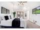 Bright main bedroom with a vaulted ceiling, plush carpet, ceiling fan, and access to the outdoors at 1409 W Maria Ln, Tempe, AZ 85284