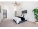 Inviting main bedroom with ceiling fan and neutral decor provides a peaceful retreat at 1409 W Maria Ln, Tempe, AZ 85284