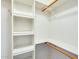 Bright walk-in closet featuring built-in shelves and ample hanging space for efficient storage at 14300 W Bell Rd # 142, Surprise, AZ 85374