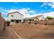 Spacious dirt backyard with block wall offers potential for landscaping and creating an outdoor oasis at 1585 E Jeanne Ln, San Tan Valley, AZ 85140