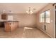 Bright dining area with tile flooring, large window, and stylish chandelier at 1585 E Jeanne Ln, San Tan Valley, AZ 85140