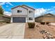 Two-story gray home featuring desert landscaping, a gray garage door, and a red tile roof at 1585 E Jeanne Ln, San Tan Valley, AZ 85140