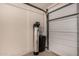 The garage features a garage door, water filtration system, and concrete flooring at 1585 E Jeanne Ln, San Tan Valley, AZ 85140